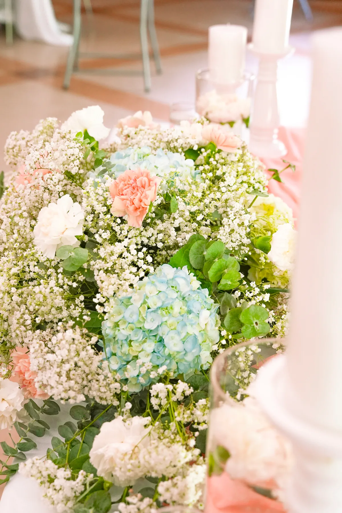 A soft arrangement of hydrangeas, carnations and baby's breath